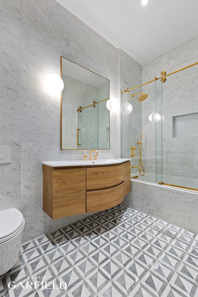 26 W 95th St, New York City, NY 10025 - full bath with vanity, enclosed tub / shower combo, tile patterned floors, toilet, and tile walls