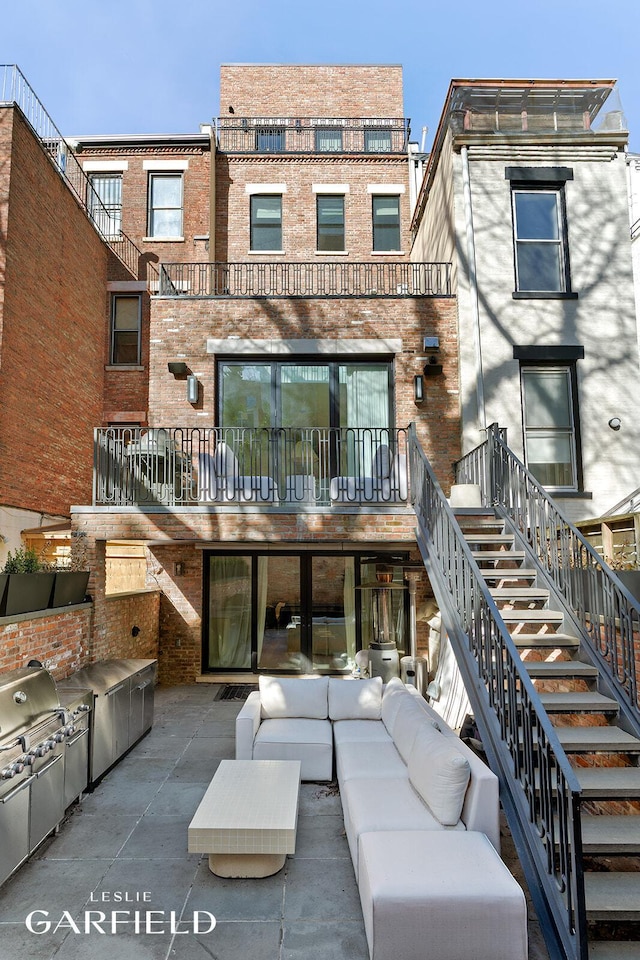 26 W 95th St, New York City, NY 10025 - back of house with a patio area, brick siding, area for grilling, and an outdoor hangout area