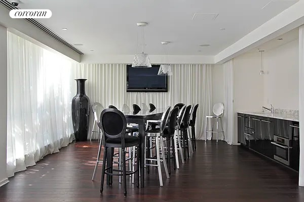 dining room with visible vents and dark wood-type flooring