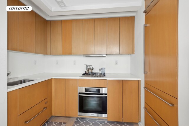 340 E 23rd St Unit Ph1B, New York City, NY 10010 - kitchen with stainless steel appliances, light countertops, and a sink