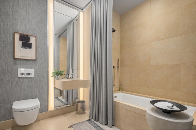 53 W 53rd St Unit 49A, New York City, NY 10019 - bathroom featuring tile patterned floors, wallpapered walls, toilet, and tiled shower / bath