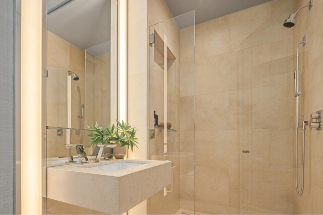 53 W 53rd St Unit 49A, New York City, NY 10019 - bathroom featuring a sink and a shower stall