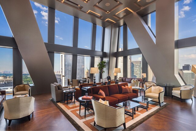 53 W 53rd St Unit 49A, New York City, NY 10019 - living area featuring a city view, expansive windows, and a towering ceiling
