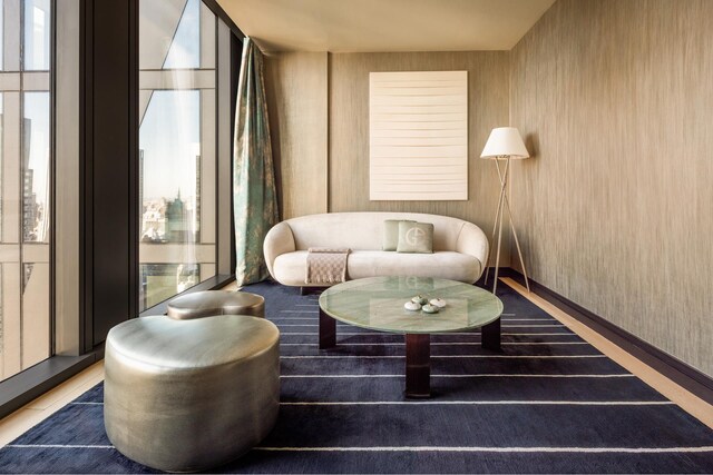 53 W 53rd St Unit 49A, New York City, NY 10019 - living area featuring baseboards and expansive windows