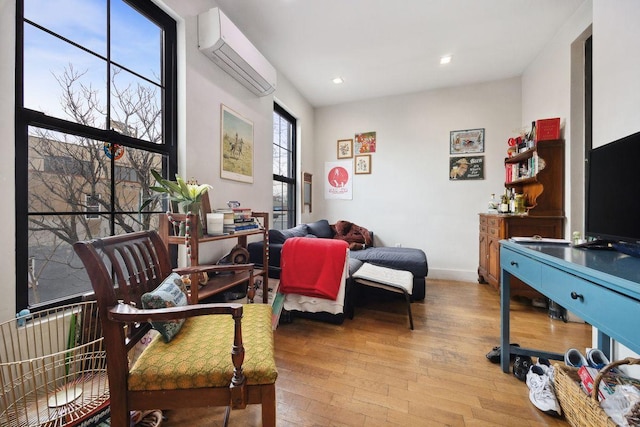 118 Kingsland Ave Unit 1, New York City, NY 11222 - sitting room featuring a wall mounted AC, hardwood / wood-style floors, recessed lighting, and baseboards