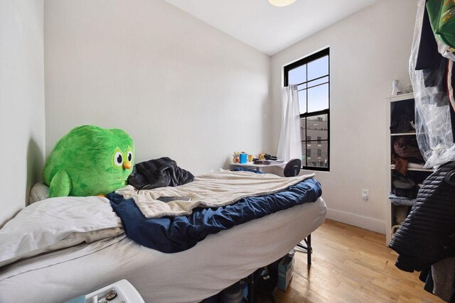 118 Kingsland Ave Unit 1, New York City, NY 11222 - bedroom featuring wood-type flooring and baseboards