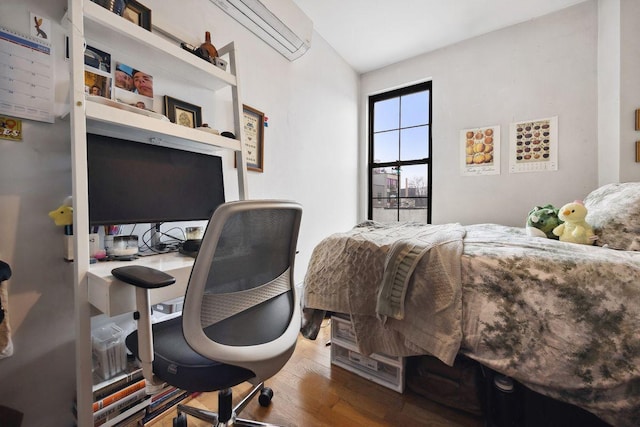 118 Kingsland Ave Unit 1, New York City, NY 11222 - bedroom with a wall mounted AC, wood finished floors, a desk, and vaulted ceiling