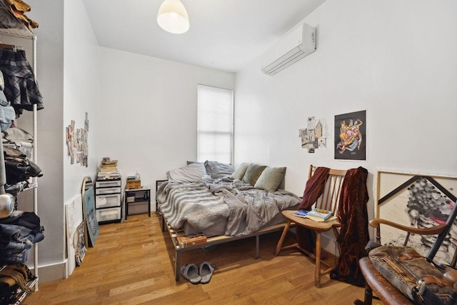 118 Kingsland Ave Unit 1, New York City, NY 11222 - bedroom featuring light wood-style floors and a wall mounted air conditioner