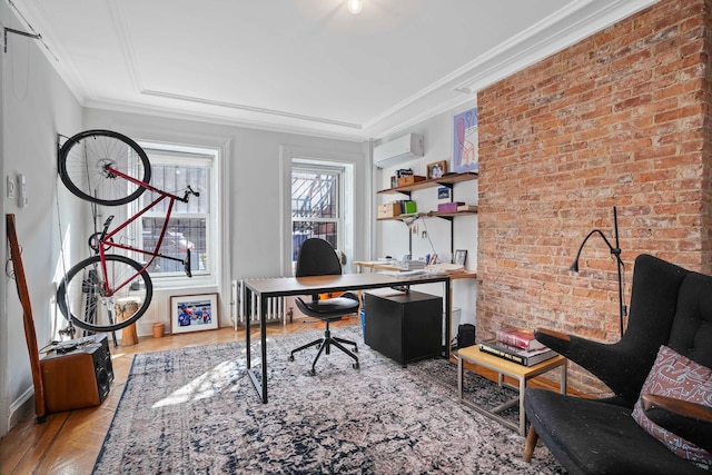 office area featuring brick wall, ornamental molding, a wall mounted air conditioner, and wood finished floors