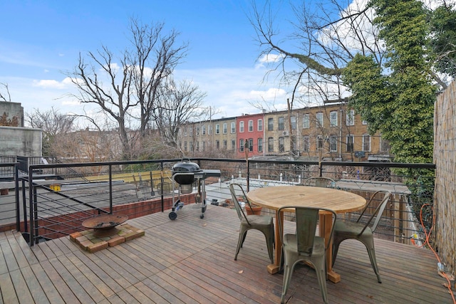 wooden deck with grilling area