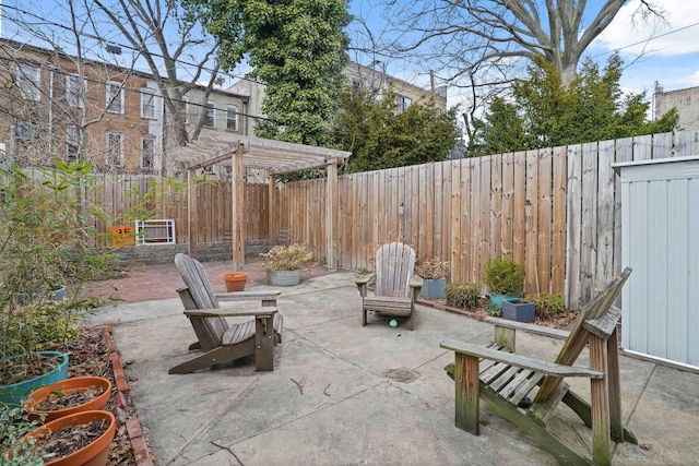 view of patio featuring a fenced backyard and a pergola