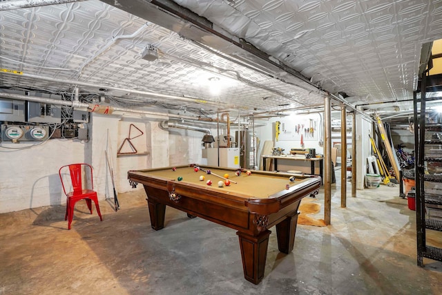 game room with concrete flooring, gas water heater, and pool table