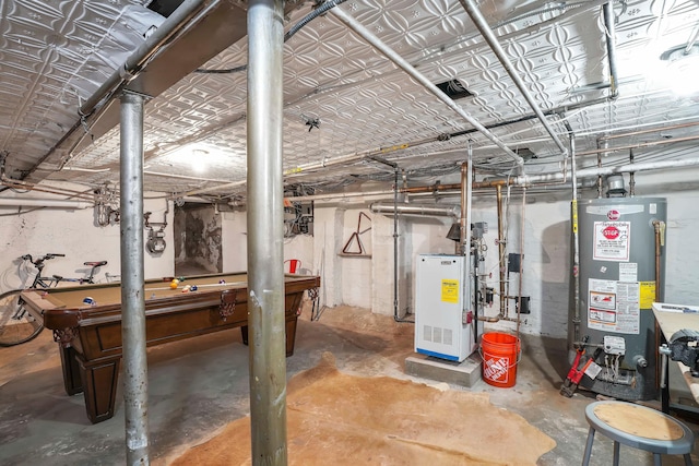 unfinished basement with a heating unit, water heater, and billiards