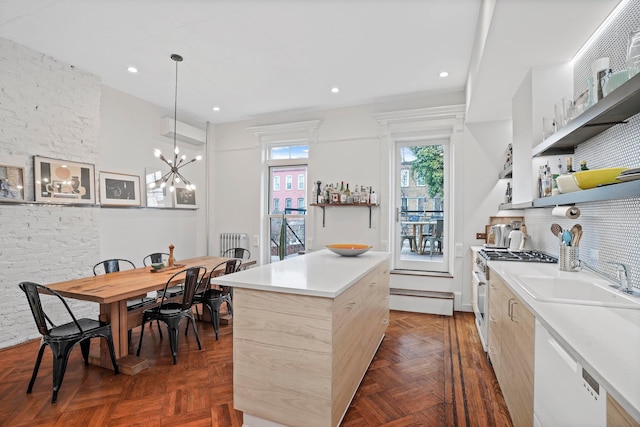 kitchen with tasteful backsplash, white range with gas stovetop, dishwashing machine, open shelves, and a sink