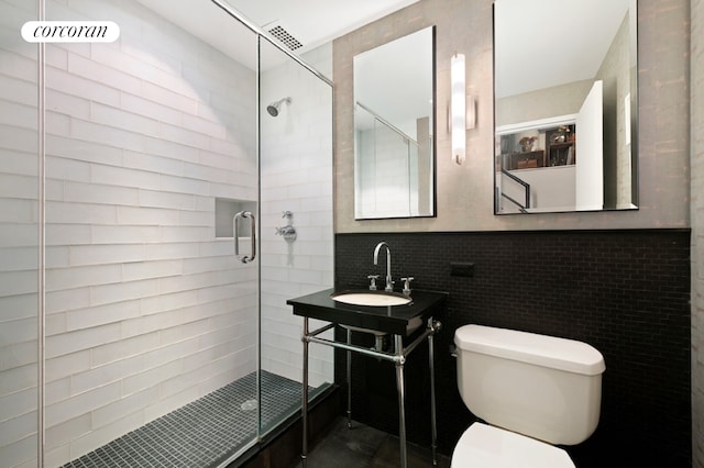 145 Nassau St Unit 8A, New York City, NY 10038 - bathroom with a shower stall, toilet, and vanity