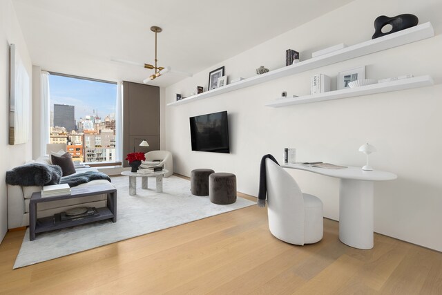 251 W 14th Street Penthouse, New York City, NY 10011 - living area with wood finished floors and a chandelier