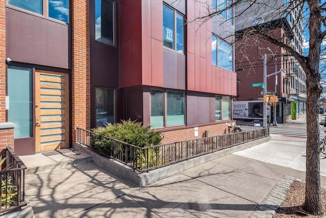 exterior space featuring brick siding