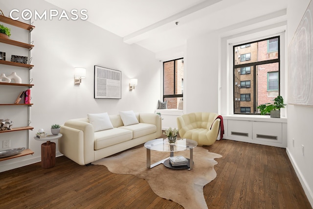 living room with beamed ceiling, baseboards, and wood-type flooring