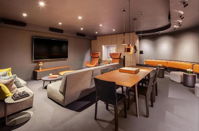 interior space featuring recessed lighting, rail lighting, and carpet