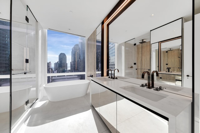 bathroom featuring a city view, a sink, a soaking tub, tile patterned floors, and double vanity