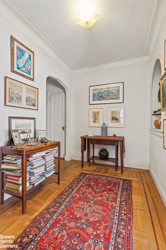 420 E 86th St Unit 4H, New York City, NY 10028 - hallway featuring arched walkways, ornamental molding, and baseboards