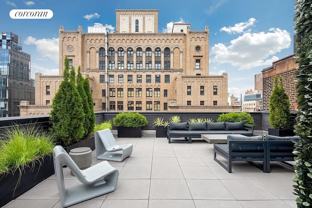 view of patio with an outdoor hangout area and a city view