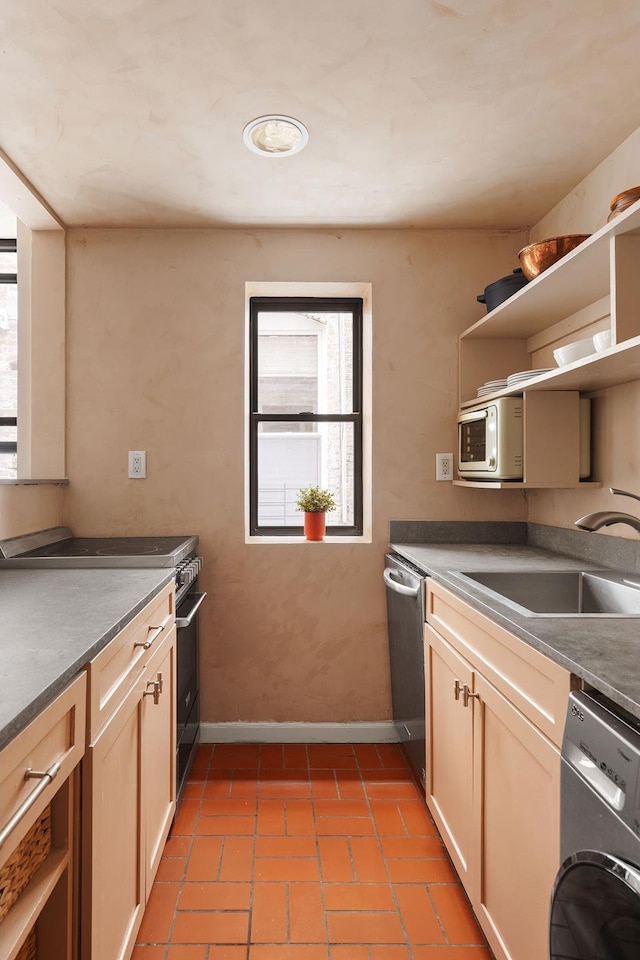 kitchen with open shelves, washer / clothes dryer, white microwave, a sink, and dishwasher