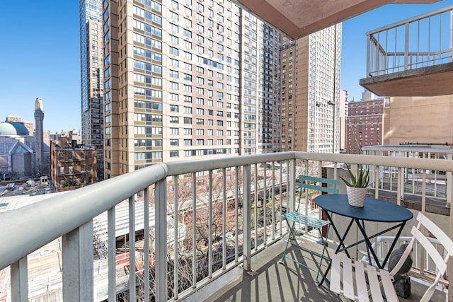 balcony featuring a city view