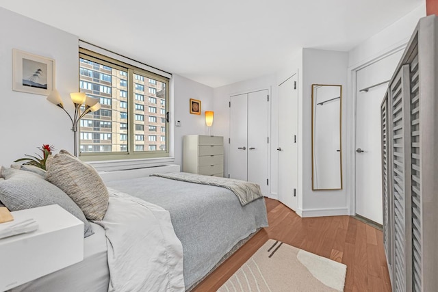 bedroom featuring a closet and wood finished floors