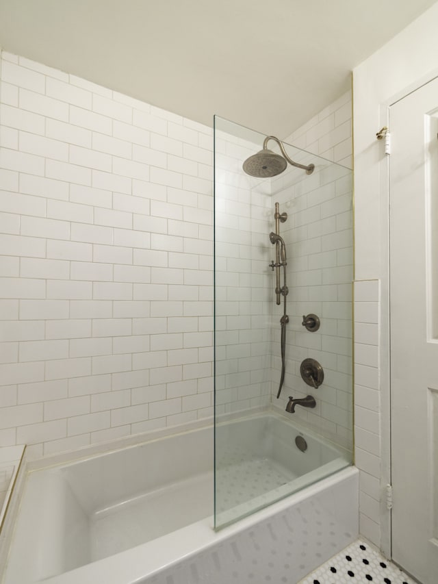 bathroom with a tile shower