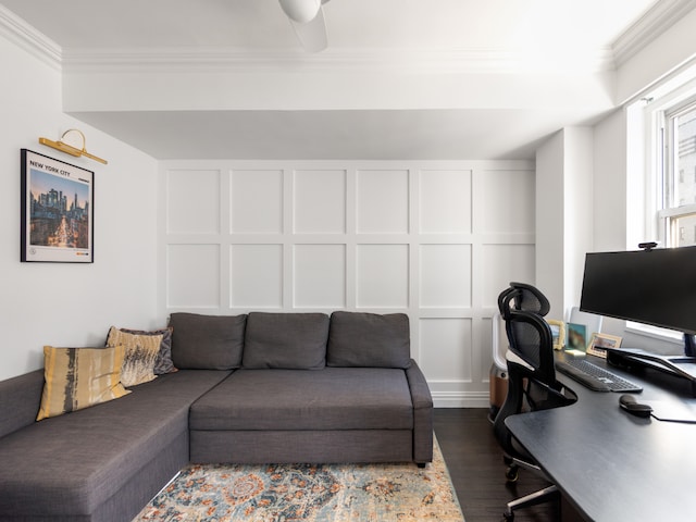 office with crown molding, wood finished floors, and a decorative wall