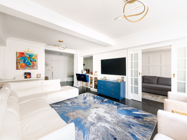 living area with dark wood-style floors, crown molding, and french doors
