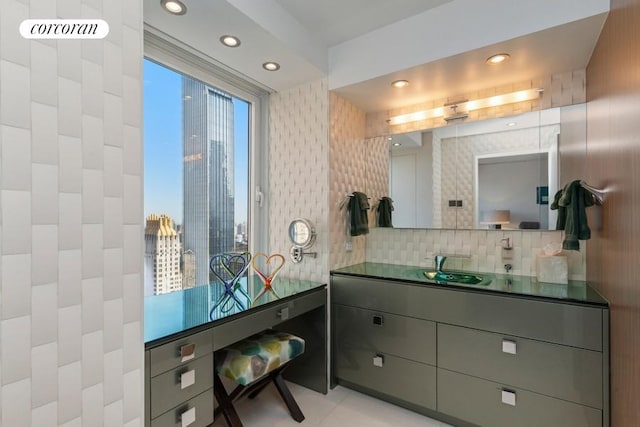 bathroom featuring backsplash, vanity, and recessed lighting