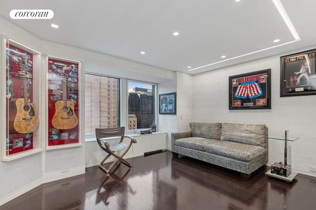 living area featuring visible vents, wood finished floors, and recessed lighting