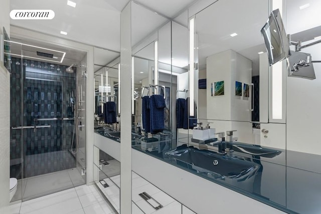 full bath with a stall shower, visible vents, toilet, tile patterned floors, and vanity