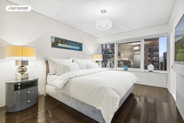 bedroom featuring visible vents and wood finished floors