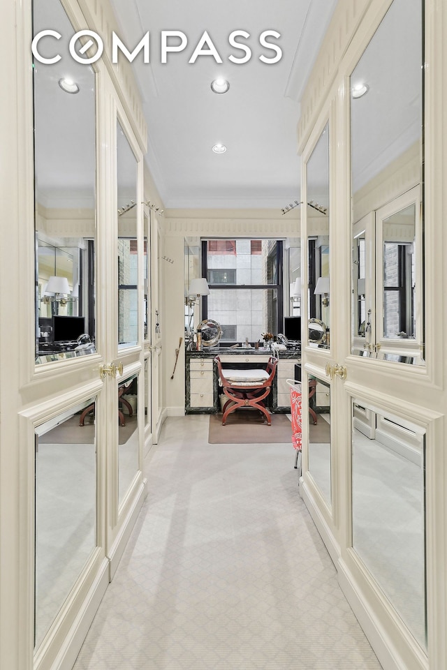 bathroom featuring crown molding, recessed lighting, and french doors