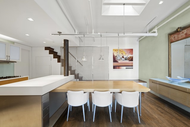 117 W 17th St Unit Ph6A, New York City, NY 10011 - dining space featuring dark wood-style flooring and stairs