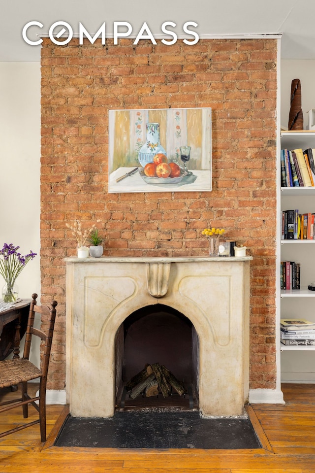 73 Bedford St, New York City, NY 10014 - detailed view of wood finished floors, baseboards, and a premium fireplace