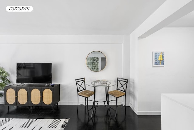 interior space with wood finished floors, visible vents, and baseboards