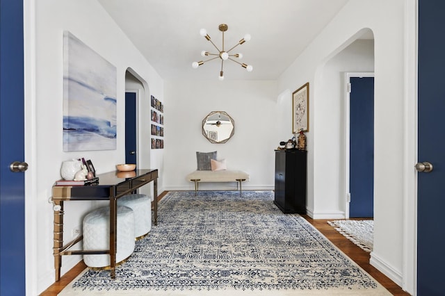 9437 Shore Rd Unit E8, New York City, NY 11209 - corridor featuring arched walkways, a chandelier, and wood finished floors