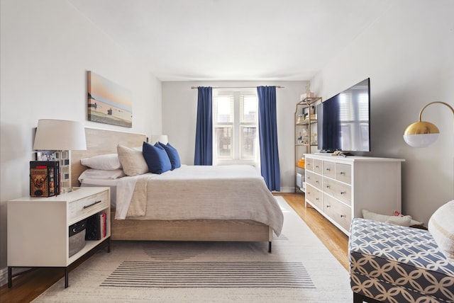 bedroom with light wood-type flooring