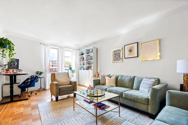 living area with baseboards and ornamental molding