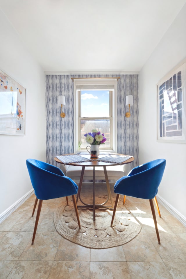 9437 Shore Rd Unit E8, New York City, NY 11209 - dining space with baseboards and wallpapered walls