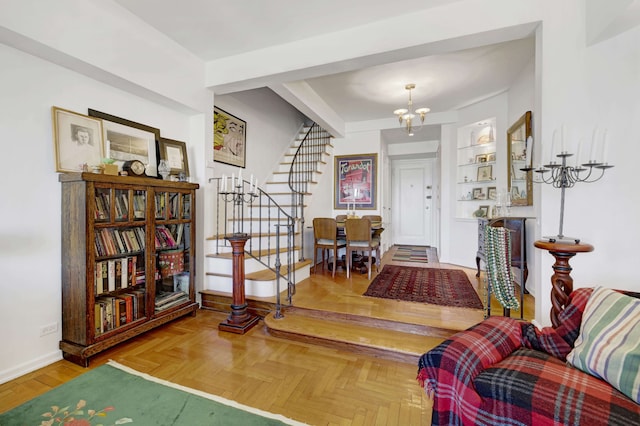 foyer entrance featuring a notable chandelier, stairway, and baseboards