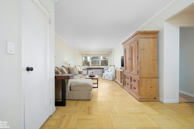 living room with baseboards and ornamental molding