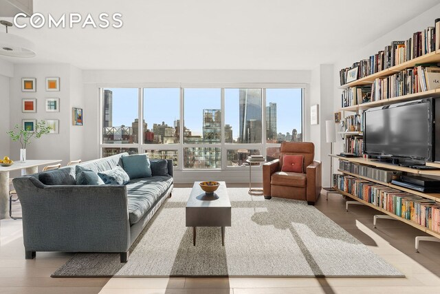 living area with a wealth of natural light and wood finished floors