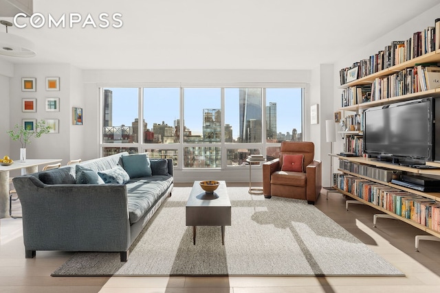 living room featuring a healthy amount of sunlight and wood finished floors