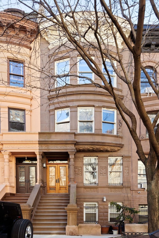 townhome / multi-family property featuring french doors