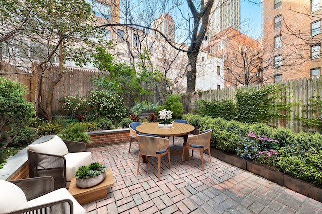 view of patio / terrace with a fenced backyard and outdoor dining space